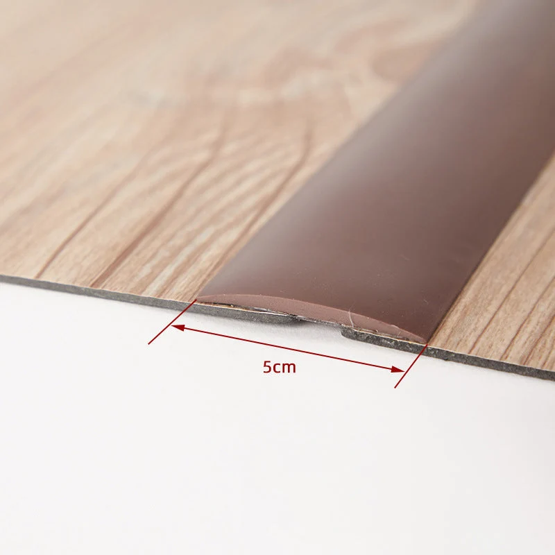 Selvklæbende overgangsliste i fleksibelt PVC til dørtrin og gulvovergange