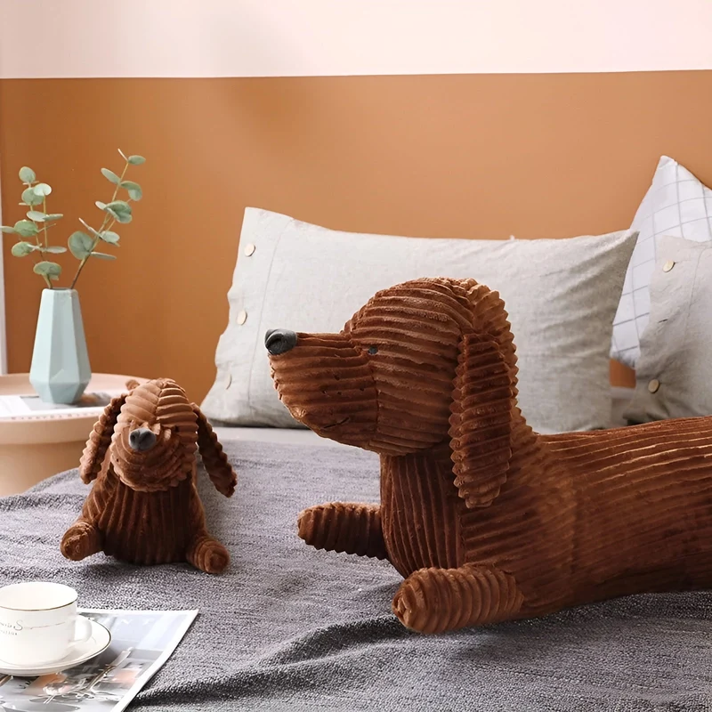 Ergonomisk pude i plysch formet som en gravhund