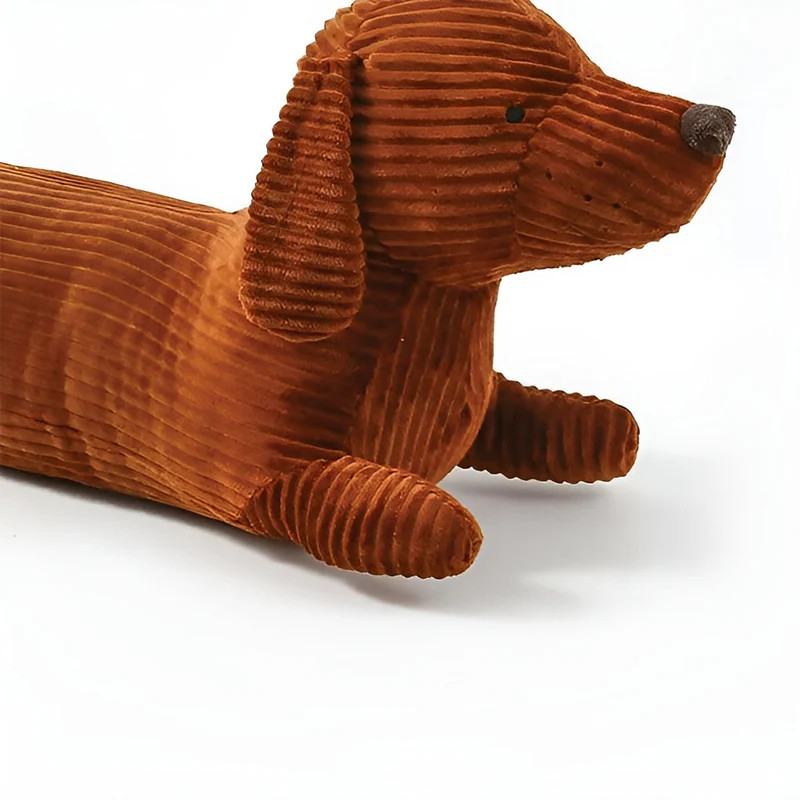 Ergonomisk pude i plysch formet som en gravhund