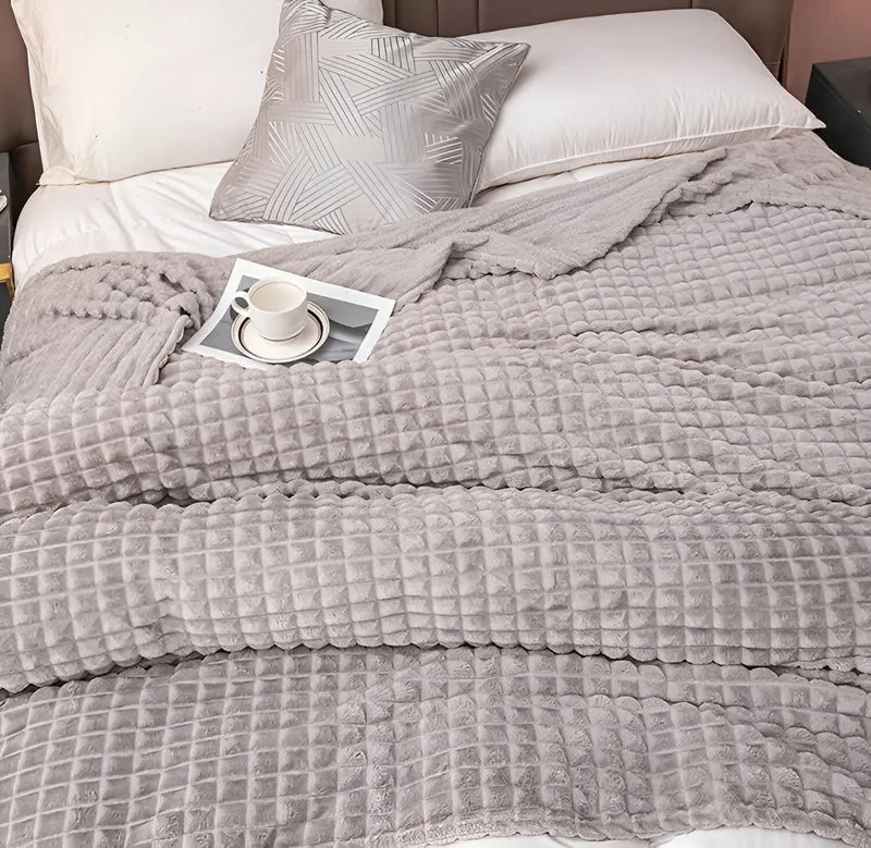 Ultrafluffy koralfarvet fleece-tæppe med struktureret plaid design