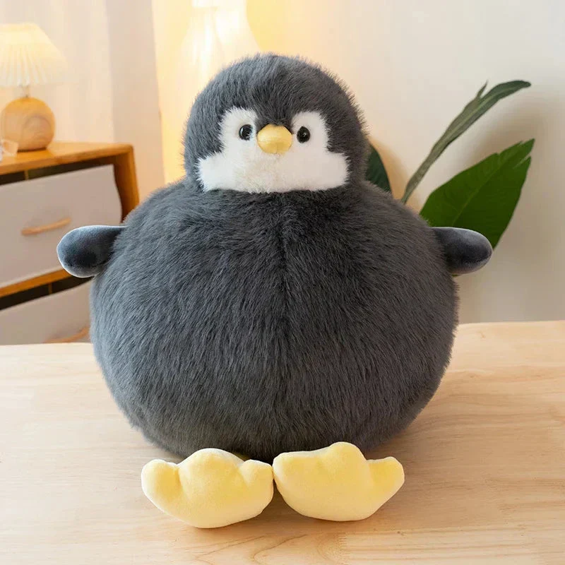 Fyldig rund pinguin krammedyr i blødt stof