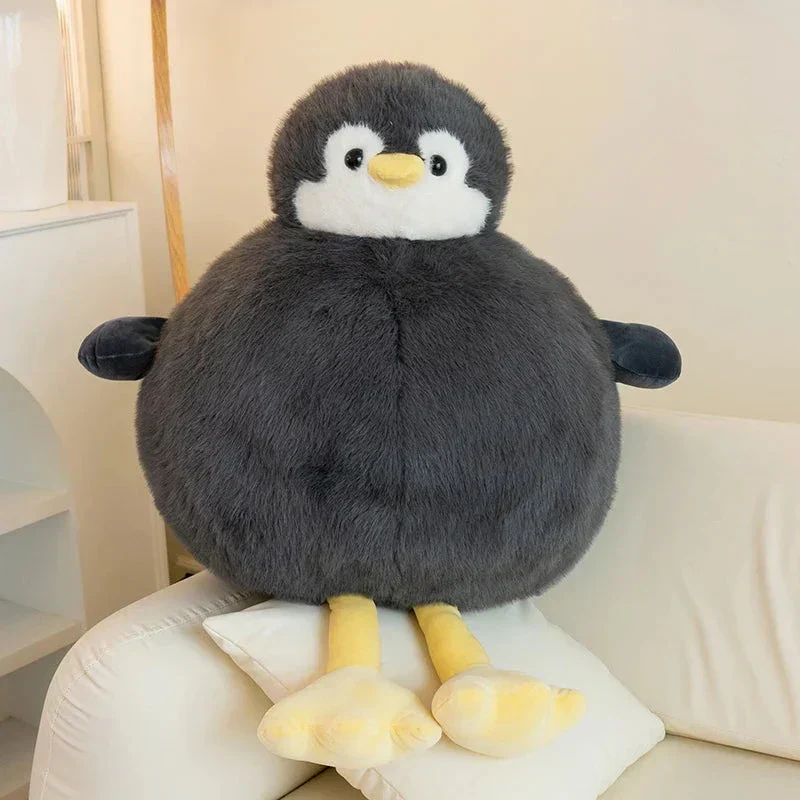Fyldig rund pinguin krammedyr i blødt stof