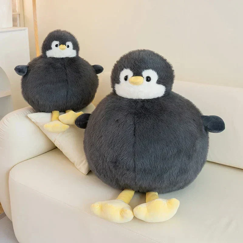 Fyldig rund pinguin krammedyr i blødt stof