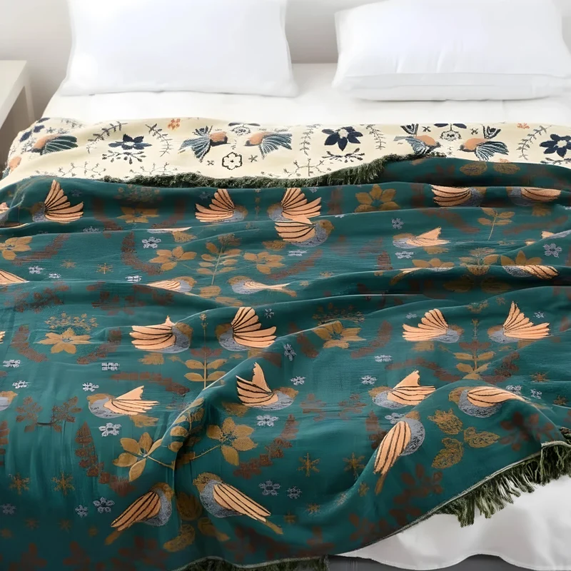 Vendbar plaid med fuglemotiv - Skandinavisk hygge til hjemmet