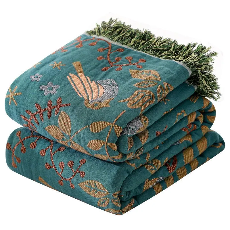Vendbar plaid med fuglemotiv - Skandinavisk hygge til hjemmet