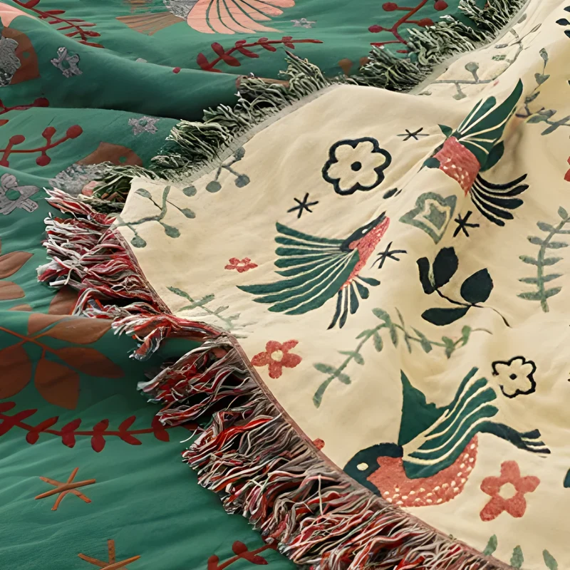 Vendbar plaid med fuglemotiv - Skandinavisk hygge til hjemmet
