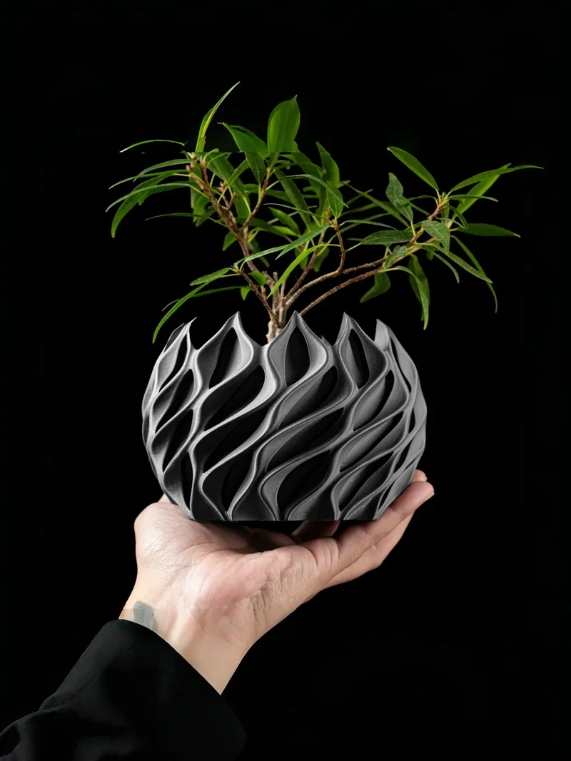 Geometrisk plantekrukke i bioplastik med unikt bølgedesign